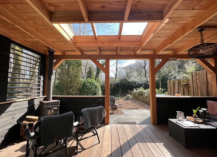 Enjoy the covered porch of Holiday Home in Epe, Veluwe, overlooking the natural surroundings of Gelderland.