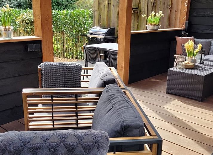 Enjoy the covered porch of Holiday Home in Epe, Veluwe, overlooking the natural surroundings of Gelderland.