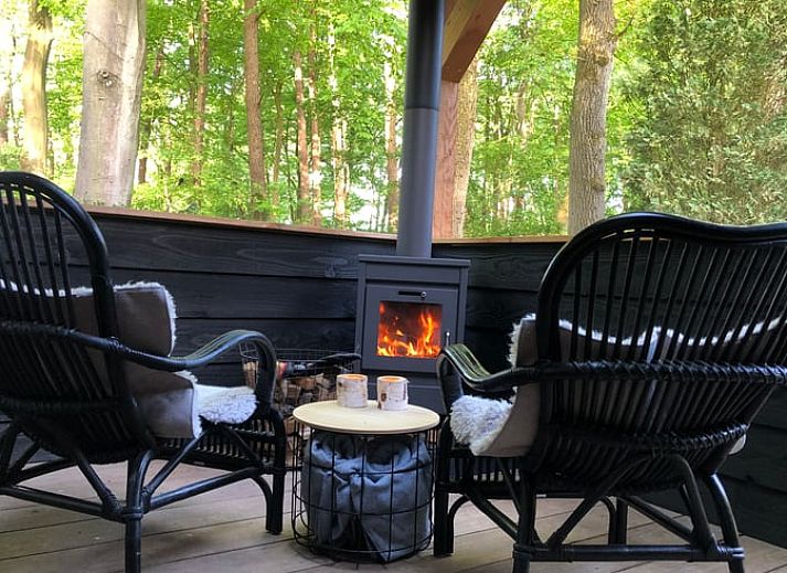 Enjoy the covered porch of Holiday Home in Epe, Veluwe, overlooking the natural surroundings of Gelderland.