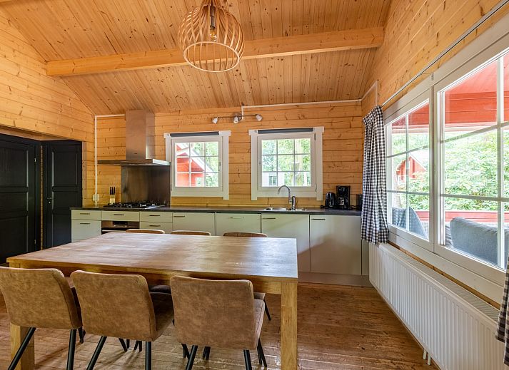 Cozy interior of Veluwe lodge in Epe, Veluwe with wooden interior and modern amenities.