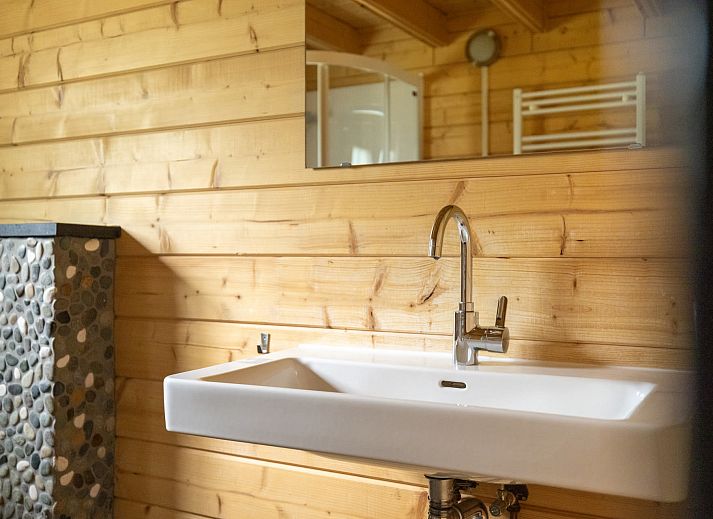 Cozy interior of Veluwe lodge in Epe, Veluwe with wooden interior and modern amenities.