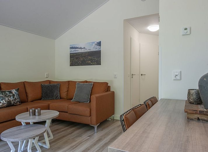 Enjoy nature on the terrace of S4A Comfort bungalow in Epe, Veluwe, Gelderland, surrounded by green forests.