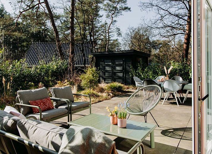 Stylish kitchen in Holiday Home in Nunspeet, Veluwe, with modern appliances and cozy dining area.