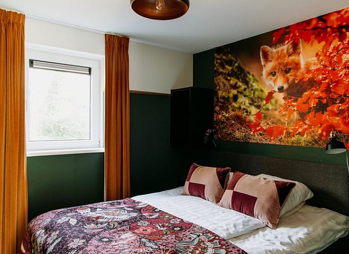 Stylish kitchen in Holiday Home in Nunspeet, Veluwe, with modern appliances and cozy dining area.