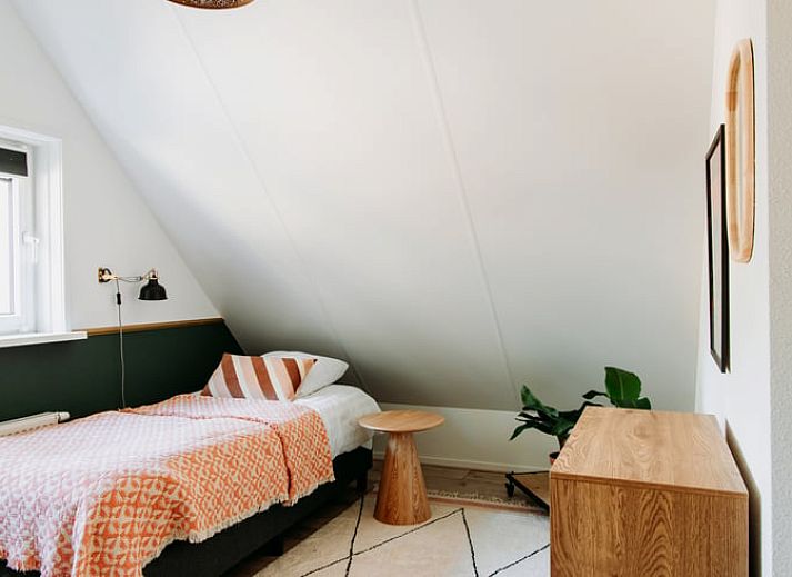 Stylish kitchen in Holiday Home in Nunspeet, Veluwe, with modern appliances and cozy dining area.