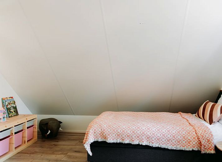 Stylish kitchen in Holiday Home in Nunspeet, Veluwe, with modern appliances and cozy dining area.