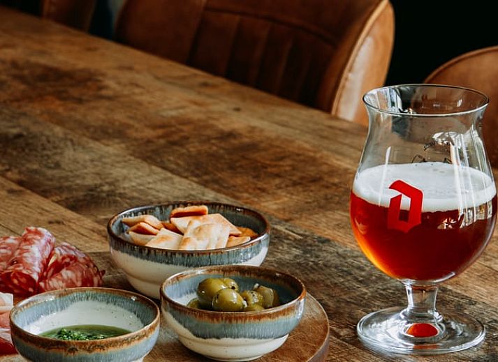 Cozy living room in Holiday home in Nunspeet, Veluwe, with comfortable seating area and stylish decoration.