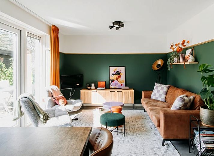 Cozy living room in Holiday home in Nunspeet, Veluwe, with comfortable seating area and stylish decoration.
