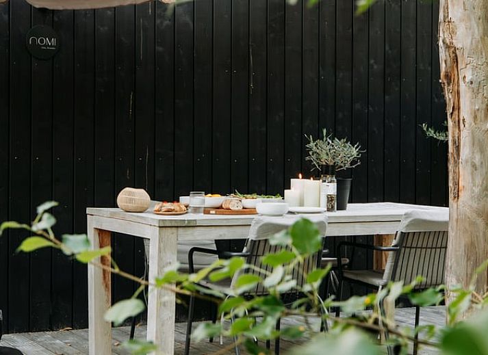 Relax in the hammock at Cottage in Nunspeet, Veluwe, Gelderland, surrounded by lush forests.