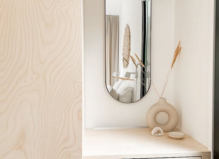 Stylish dining area in Cottage in Nunspeet, Veluwe, Gelderland with modern wooden furniture and views of nature.