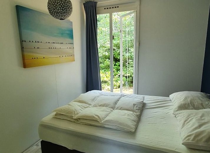 Ontspannen zithoek in de natuur bij vakantiehuis Jutta in Nunspeet, Veluwe. Geniet van rust en groen in Gelderland.