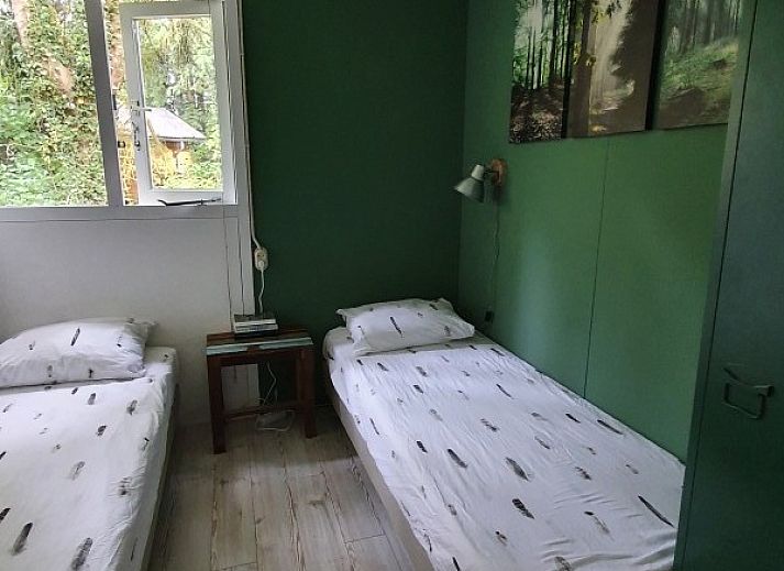 Ontspannen zithoek in de natuur bij vakantiehuis Jutta in Nunspeet, Veluwe. Geniet van rust en groen in Gelderland.