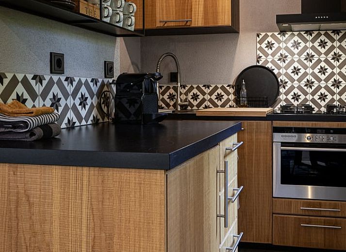 Vakantiehuis in Nunspeet, Veluwe, Gelderland bord bij entree in bosrijke omgeving.