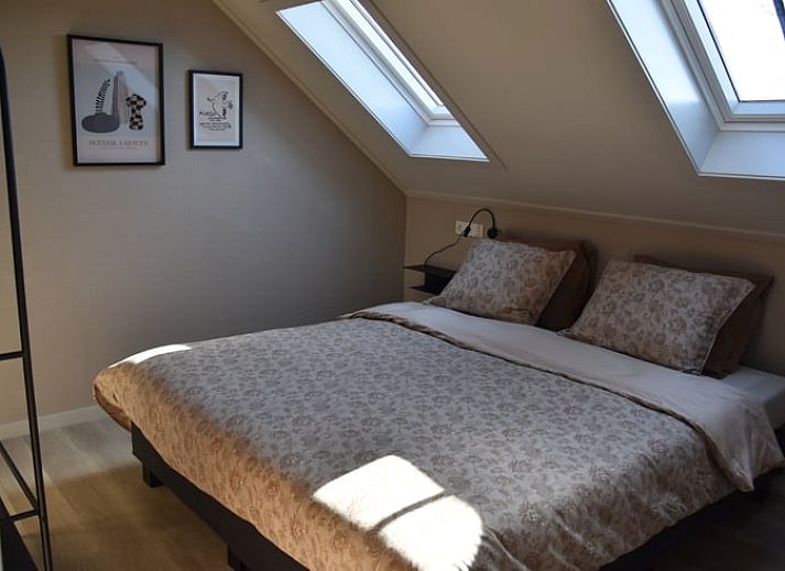 Gemuetliche Sitzecke im Ferienhaus in Lunteren mit Blick auf die Natur in Gelderland.