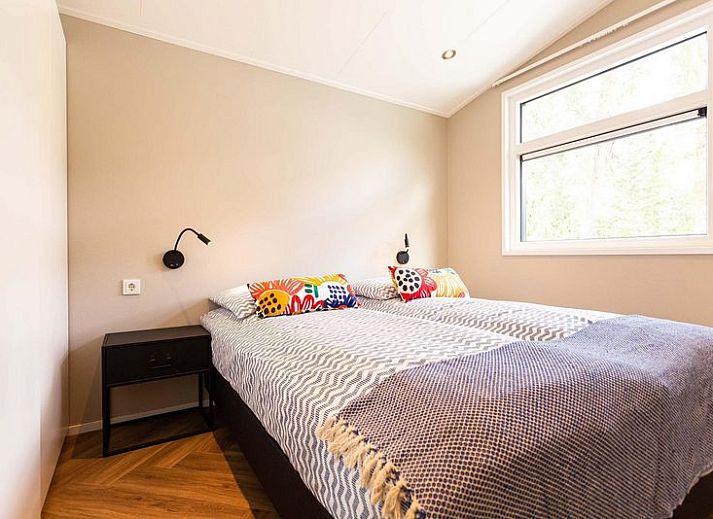 Silva 5 Personen Wellness-Ferienhaus mit Whirlpool in Lunteren, Veluwe, umgeben von gruener Natur und moderner Architektur.