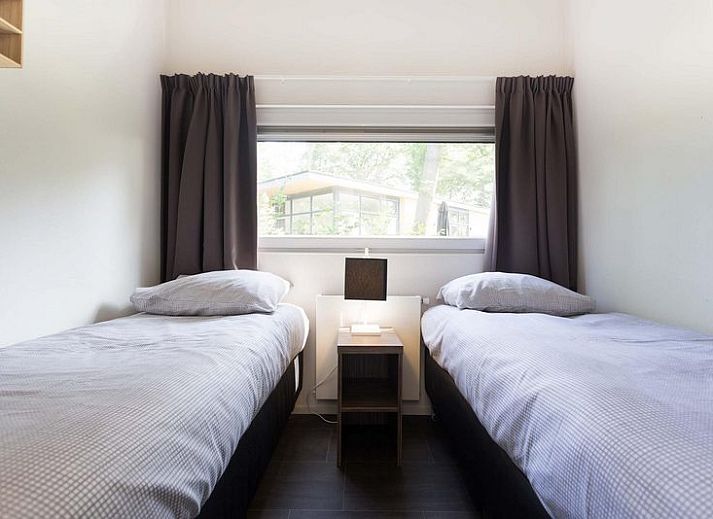 Geniet van de zon op het terras van Module 6 personen in Lunteren, Veluwe, Gelderland, een ruim vakantiehuis.