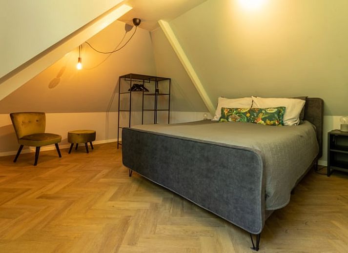 Comfortabele zithoek in Vakantiehuis in Lunteren, Veluwe, Gelderland met veel daglicht.