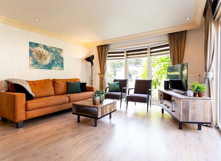 Slaapkamer in Holiday home 5 personen Wellness, Lunteren, met uitzicht op tuin, Veluwe.