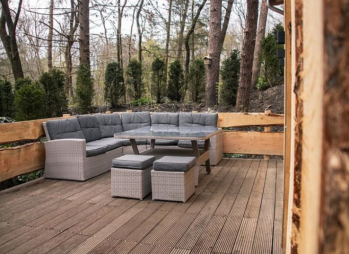 Vakantiehuisje in Uddel, Veluwe, met houten gevels en natuurlijke omgeving voor ultiem comfort.