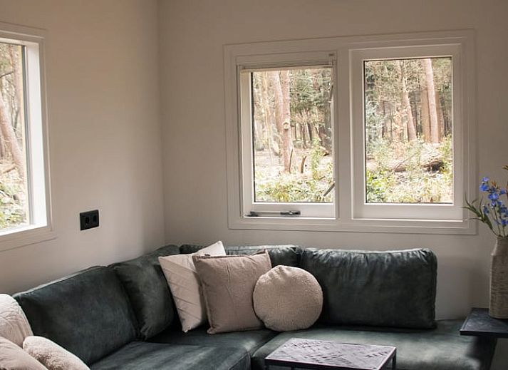 Rustiek vakantiehuisje in Uddel, Veluwe, met moderne voorzieningen en omgeven door bosrijke natuur.