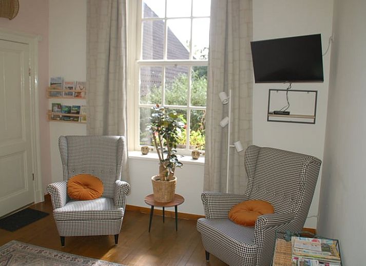 Ferienhaus in De Steeg, umgeben von weiten Feldern in Veluwe, Gelderland.