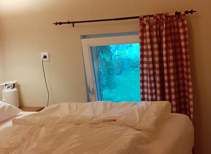 Shaded porch at cottage in Heerde, Veluwe vacation home in Gelderland.