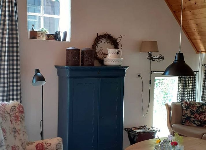 Spring flowers adorn the garden at Cottage in Heerde, Veluwe vacation home in Gelderland.