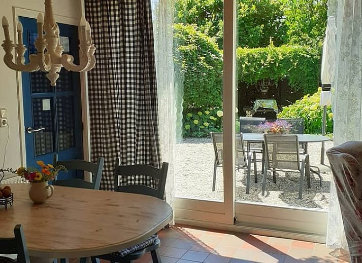 Spring flowers adorn the garden at Cottage in Heerde, Veluwe vacation home in Gelderland.