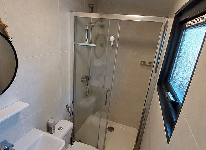 Cozy living room in Cottage in Hattemerbroek, Veluwe vacation home with comfortable seating area.