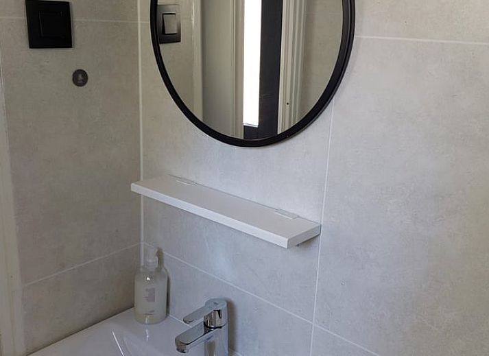 Cozy living room in Cottage in Hattemerbroek, Veluwe vacation home with comfortable seating area.