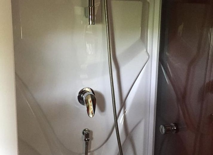 Natuurrijke omgeving van Vakantiehuis in Doornspijk, Veluwe, Gelderland met groene velden.