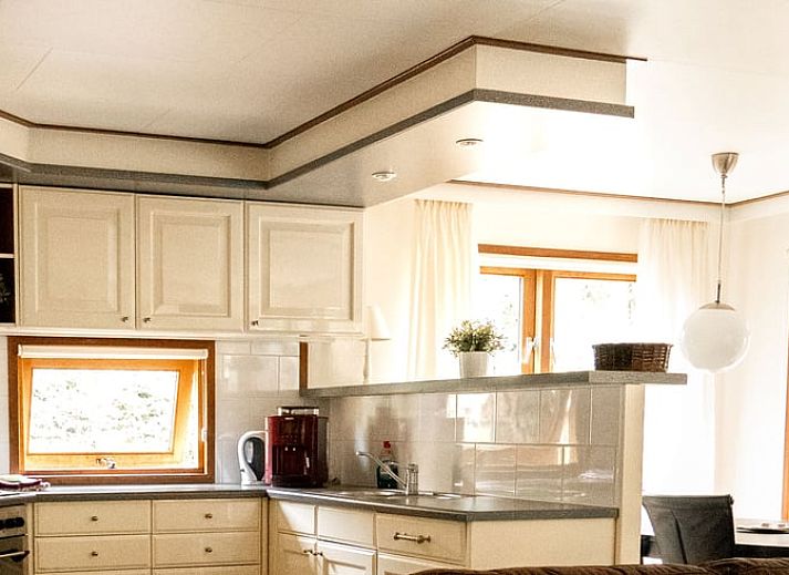 Comfortable seating area on the terrace of Holiday Home in Doornspijk, Veluwe, Gelderland.