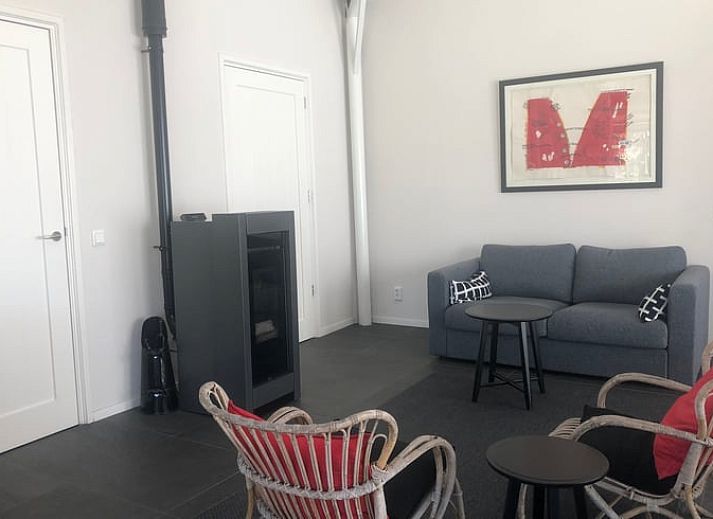 Cozy interior of Cottage in Wapenveld, Veluwe, Gelderland. Vacation home with stylish decor and views of the green garden.