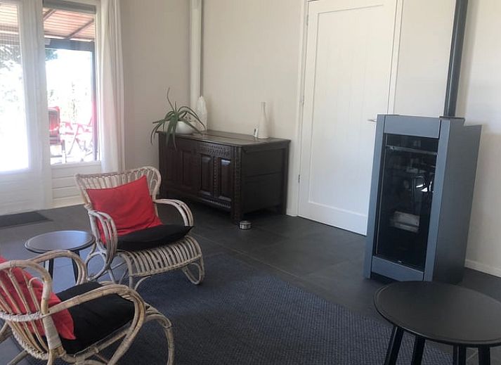 Cozy interior of Cottage in Wapenveld, Veluwe, Gelderland. Vacation home with stylish decor and views of the green garden.