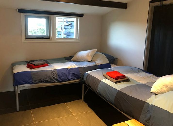 Cozy interior of Cottage in Wapenveld, Veluwe, Gelderland. Vacation home with stylish decor and views of the green garden.