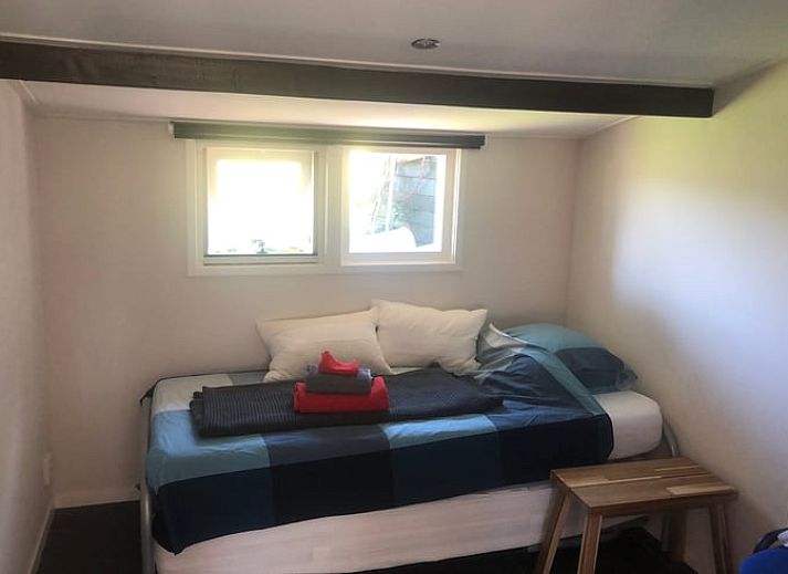 Cozy interior of Cottage in Wapenveld, Veluwe, Gelderland. Vacation home with stylish decor and views of the green garden.