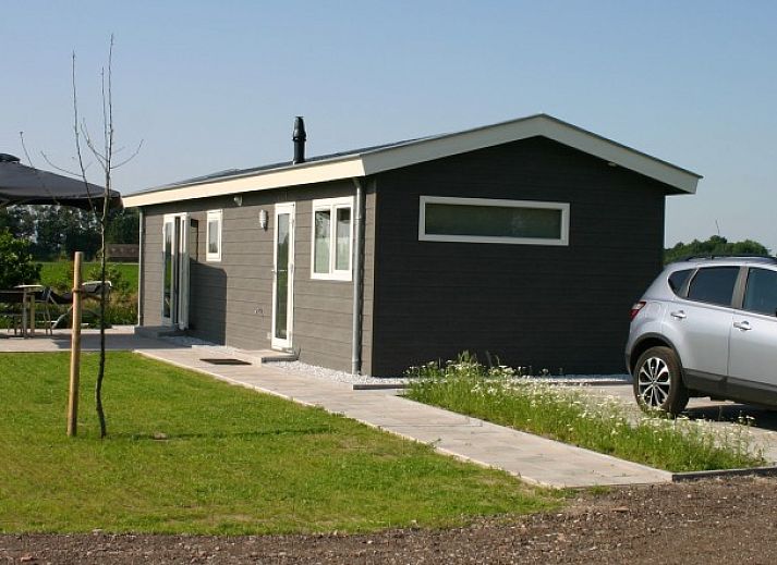 Van Luttikhuizen chalet rental Zwaantje 1 in Teuge, Veluwe offers beautiful views of the green surroundings and comfortable outdoor space.