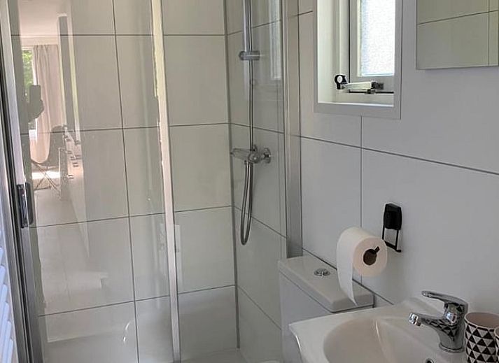 Vakantiehuisje in Lieren met ruime tuin en zitgedeelte, ideaal voor ontspanning op de Veluwe.