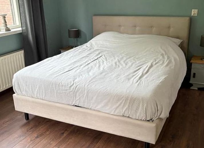 Gezellige woonkamer van Vakantiehuisje in Wekerom, Veluwe, met comfortabele zithoek.