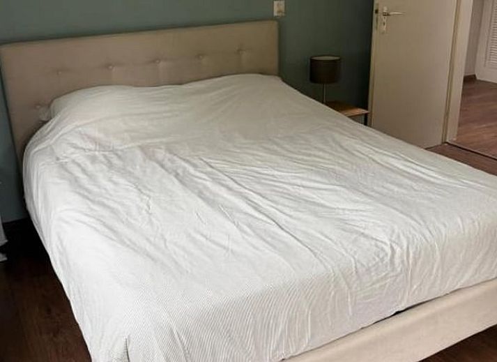 Gezellige woonkamer van Vakantiehuisje in Wekerom, Veluwe, met comfortabele zithoek.