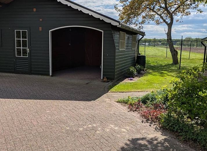 Eethoek met uitzicht op de natuur in Vakantiehuisje in Wekerom, Veluwe.