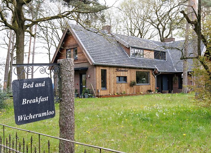 Slaapkamer in Huisje in Wekerom, vakantiewoning op de Veluwe, Gelderland met sfeervolle decoratie.