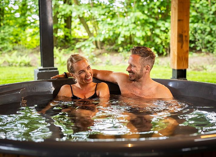 Enjoying the Hot Tub of Nature Villa with Hot Tub in Wekerom, Veluwe, vacation home.