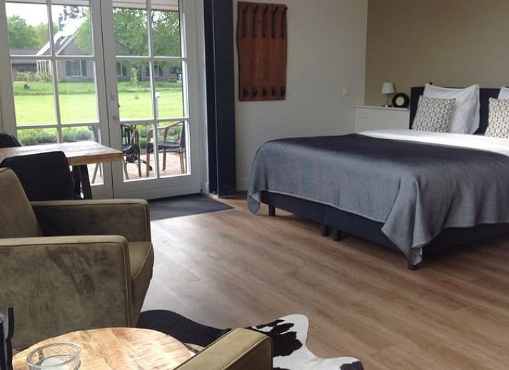 Vakantiehuisje in Eerbeek op de Veluwe, Gelderland, omgeven door groene natuur en rustieke charme.