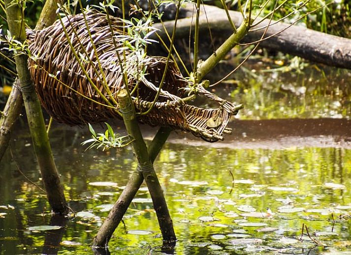 Comfortable seating area in Holiday Home in Wenum Wiesel, Veluwe, Gelderland, with decorative cushions.