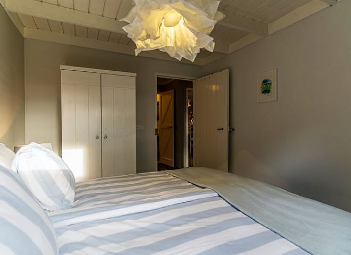 Gemuetliches Wohnzimmer mit Holzofen im Ferienhaus Wenum Wiesel, Veluwe.