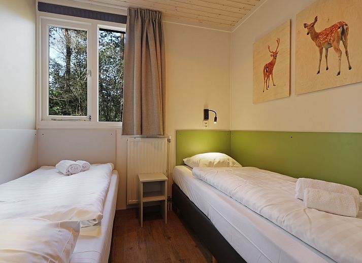 Spacious living room with open kitchen in Rabbit Hill 6-bed bungalow, Veluwe.