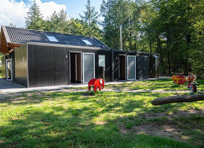 Enjoy nature at Rabbit Hill, Comfort camping site C10+ in Nieuw Milligen, Veluwe, with a spacious tent and cozy outdoor seating area.