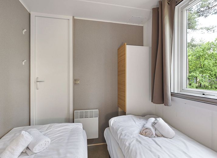 Cozy dining area in Rabbit Hill 6-person mobile home, located in the Veluwe, Nieuw Milligen