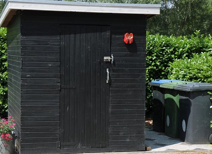 Gemuetlicher Innenbereich des Ferienhauses in Stroe, Veluwe, mit bequemen Sitzgelegenheiten.